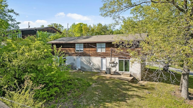 810 Forest Dale Ln, Hixson, TN 37343 - rear view of house featuring a lawn, a patio, entry steps, and central AC unit