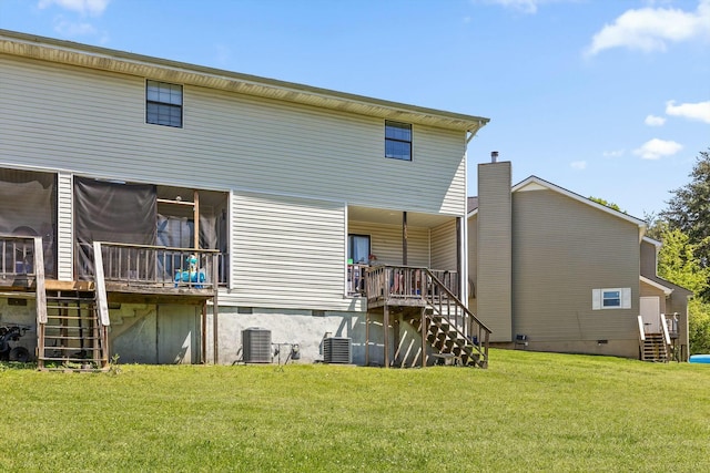 rear view of property featuring central AC unit, a wooden deck, stairway, a yard, and crawl space