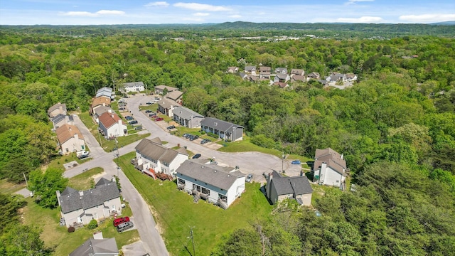 aerial view featuring a residential view and a wooded view