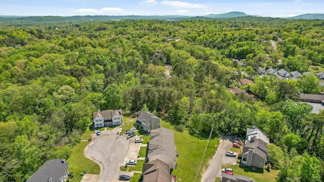 drone / aerial view with a view of trees and a residential view