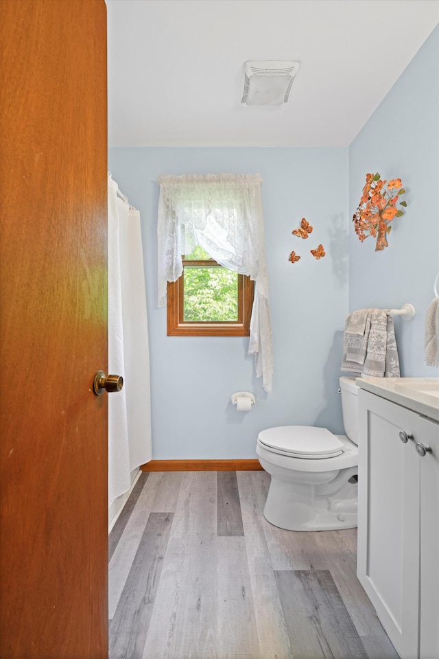 798 Deerfield Ln, Sugar Valley, GA 30746 - bathroom featuring baseboards, wood finished floors, vanity, and toilet