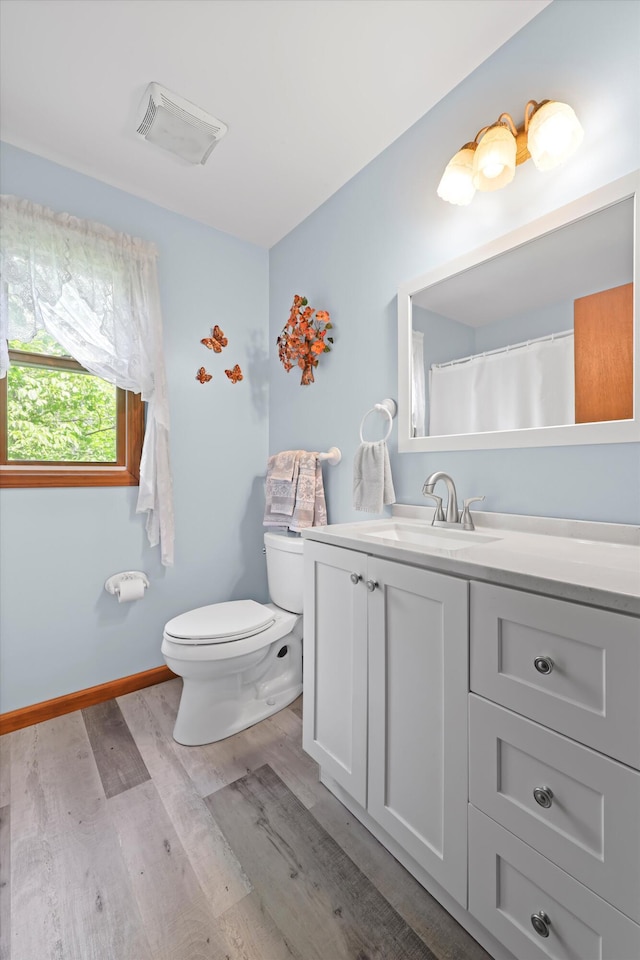 798 Deerfield Ln, Sugar Valley, GA 30746 - full bathroom featuring toilet, visible vents, baseboards, wood finished floors, and vanity