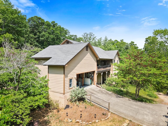 798 Deerfield Ln, Sugar Valley, GA 30746 - view of front of property with a balcony, a shingled roof, and concrete driveway