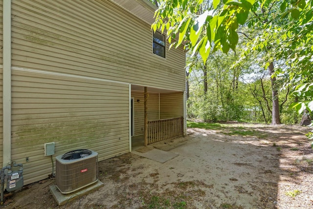view of side of property with central AC unit