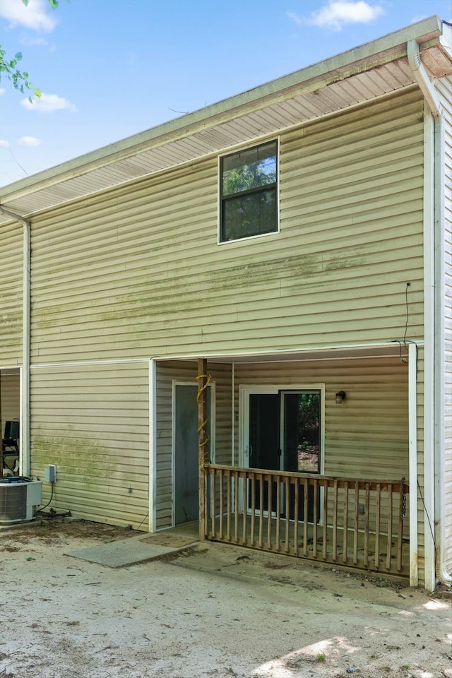 back of property with central AC unit