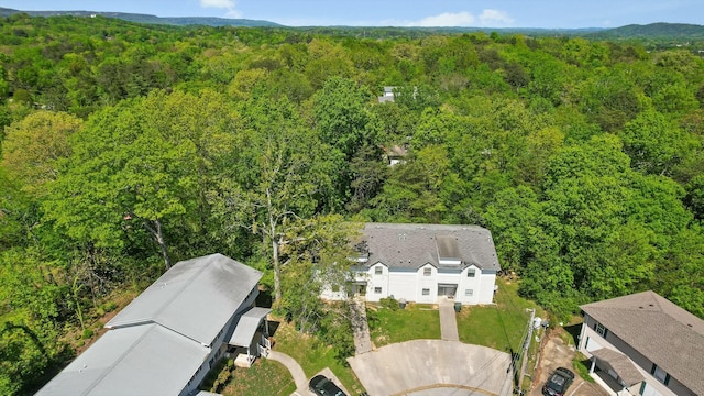bird's eye view featuring a view of trees