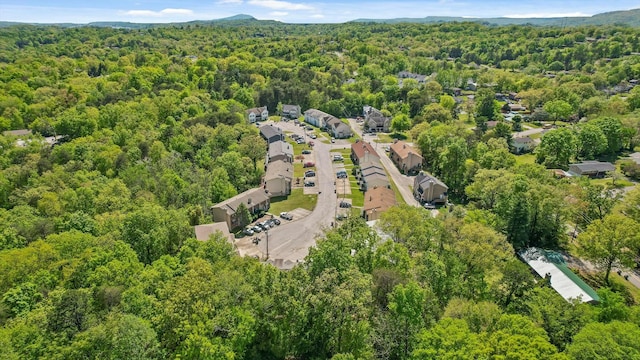 aerial view featuring a wooded view