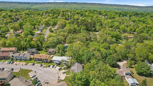 birds eye view of property with a residential view and a wooded view