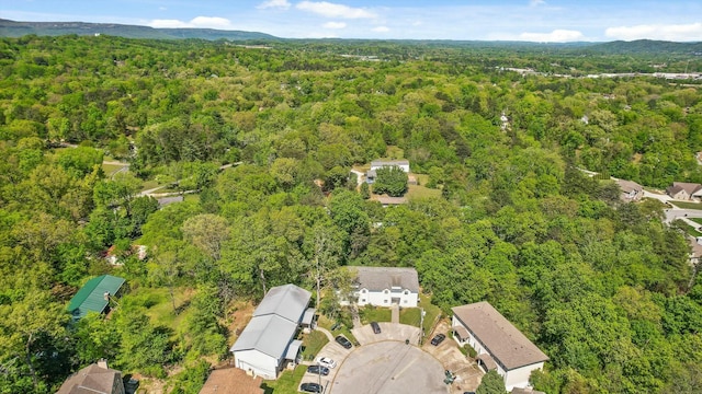 drone / aerial view with a view of trees