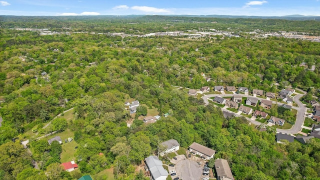 drone / aerial view featuring a forest view