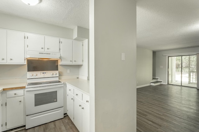 kitchen with white electric range oven, under cabinet range hood, wood finished floors, and a textured ceiling