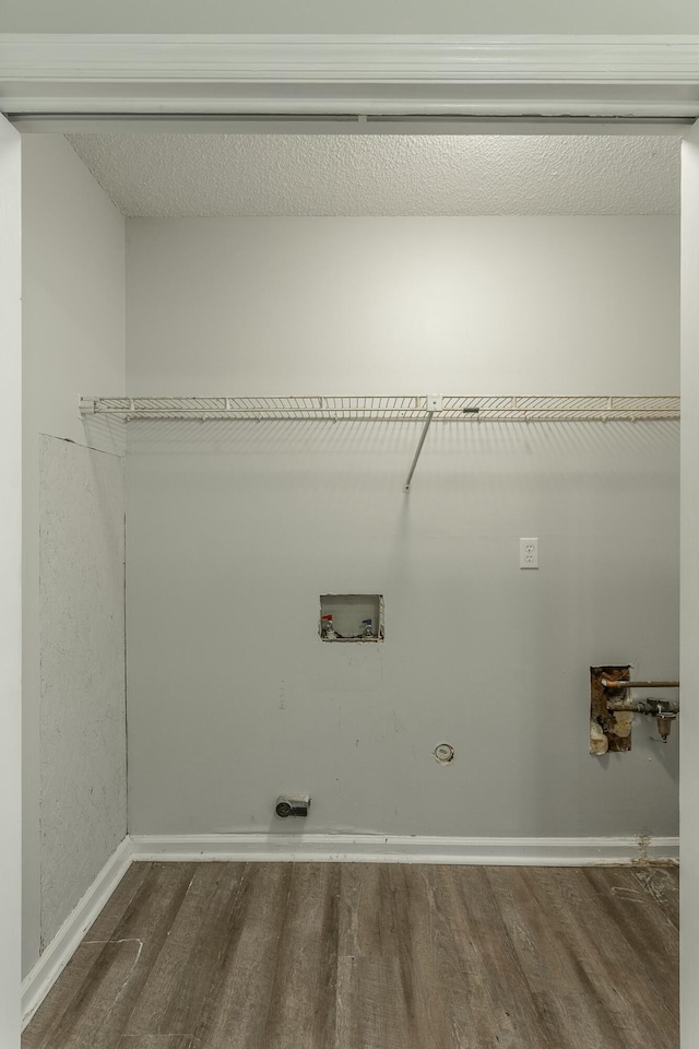 laundry area with wood finished floors, laundry area, washer hookup, and hookup for an electric dryer