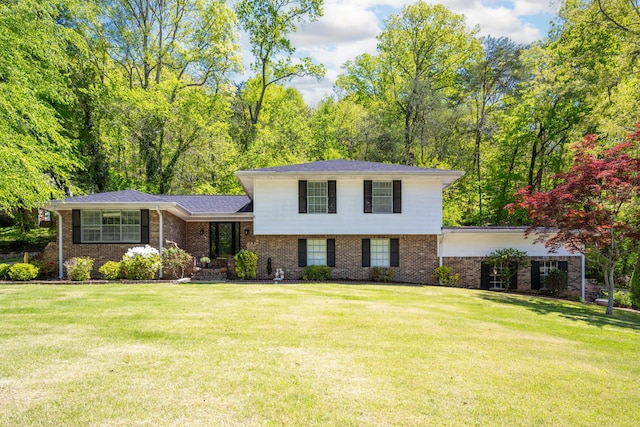 4802 Woodland Cir, Hixson, TN 37343 - tri-level home with brick siding and a front yard
