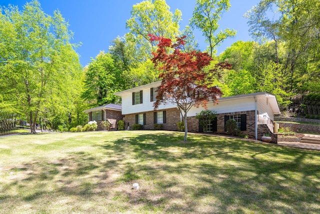 4802 Woodland Cir, Hixson, TN 37343 - view of front facade with a front lawn and brick siding