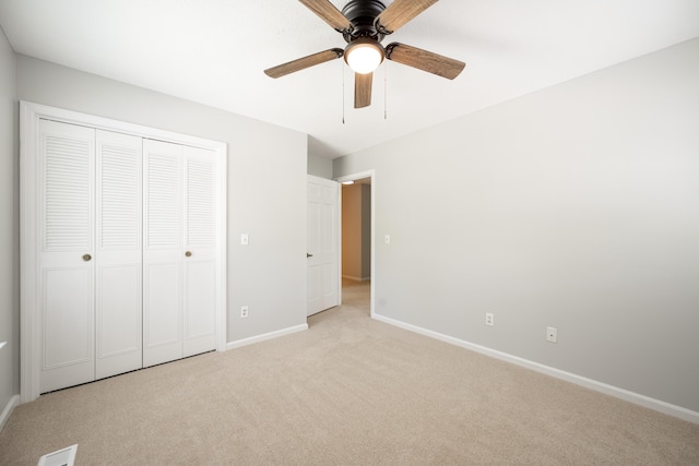 4802 Woodland Cir, Hixson, TN 37343 - unfurnished bedroom with ceiling fan, baseboards, a closet, and light colored carpet