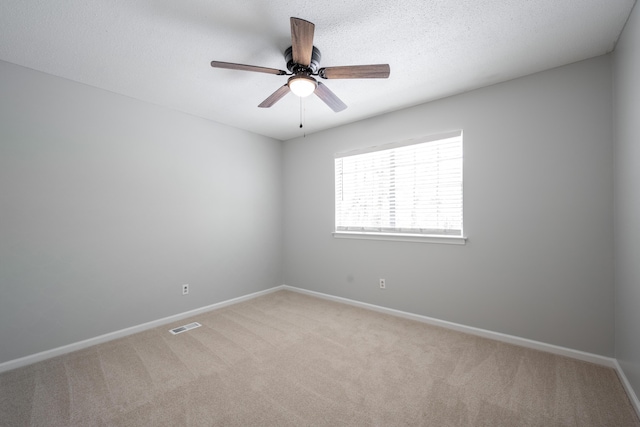 4802 Woodland Cir, Hixson, TN 37343 - empty room featuring visible vents, a ceiling fan, baseboards, and light colored carpet