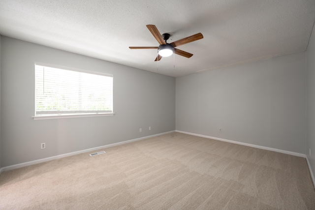 4802 Woodland Cir, Hixson, TN 37343 - unfurnished room with visible vents, light carpet, baseboards, a textured ceiling, and ceiling fan