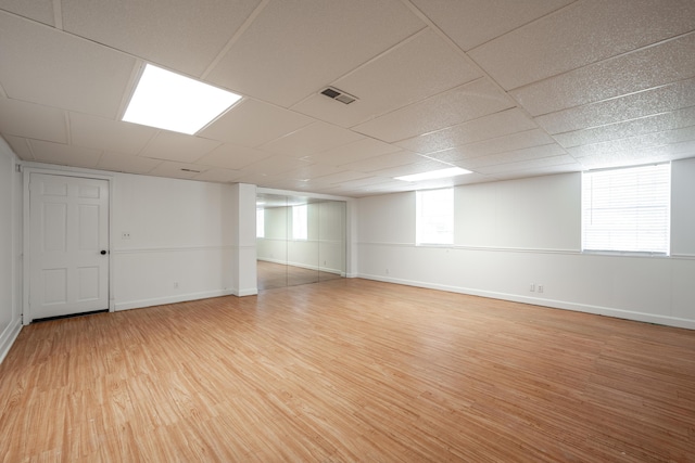 4802 Woodland Cir, Hixson, TN 37343 - below grade area with visible vents, light wood finished floors, and baseboards