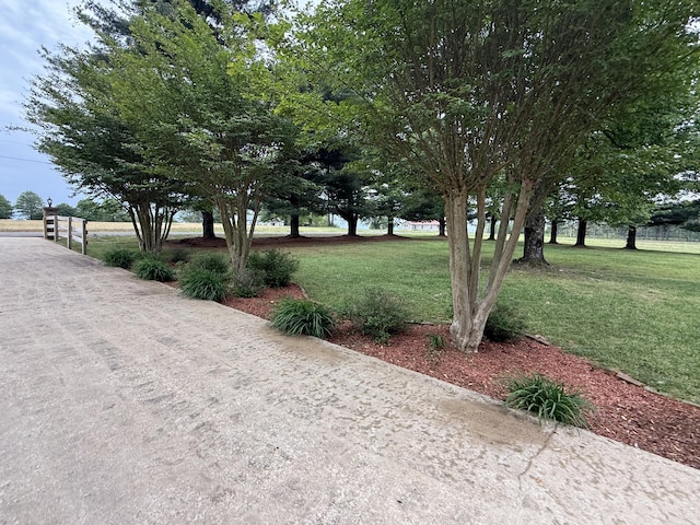 view of property's community with a lawn