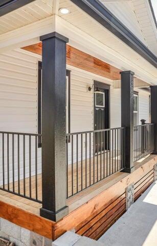 property entrance with covered porch
