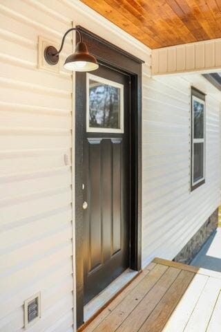 view of exterior entry with visible vents