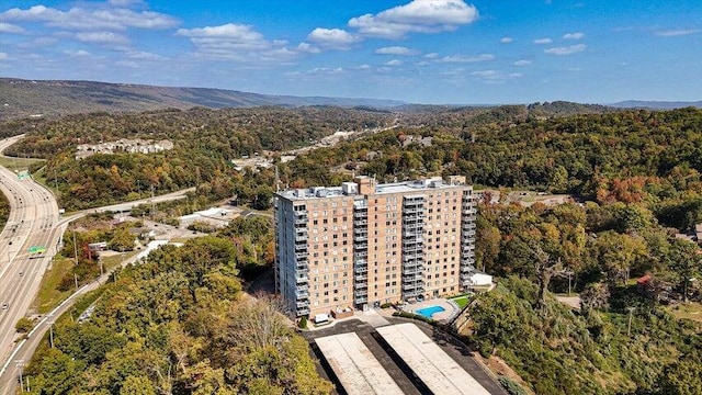 bird's eye view featuring a view of trees and a mountain view