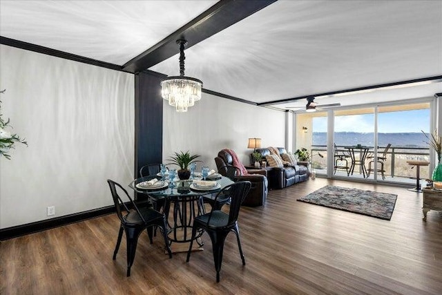 dining area with a chandelier, expansive windows, wood finished floors, and beamed ceiling