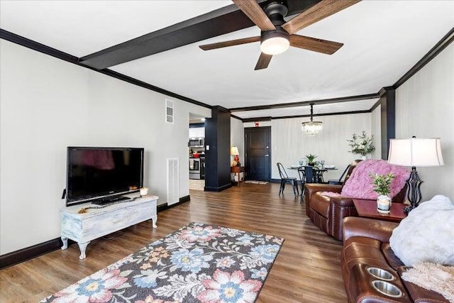 living area featuring ceiling fan, baseboards, wood finished floors, and ornamental molding