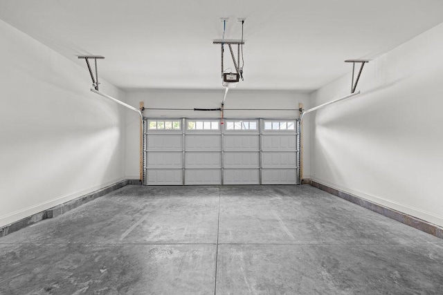 1571 Whisper Winds Ln Unit 42, Ooltewah, TN 37363 - garage featuring baseboards and a garage door opener