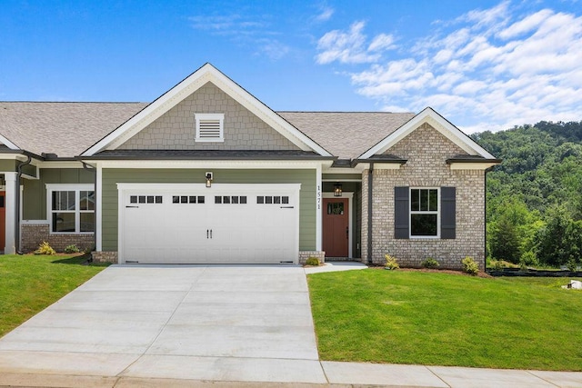 1571 Whisper Winds Ln Unit 42, Ooltewah, TN 37363 - craftsman inspired home featuring a garage, a front lawn, driveway, a shingled roof, and brick siding
