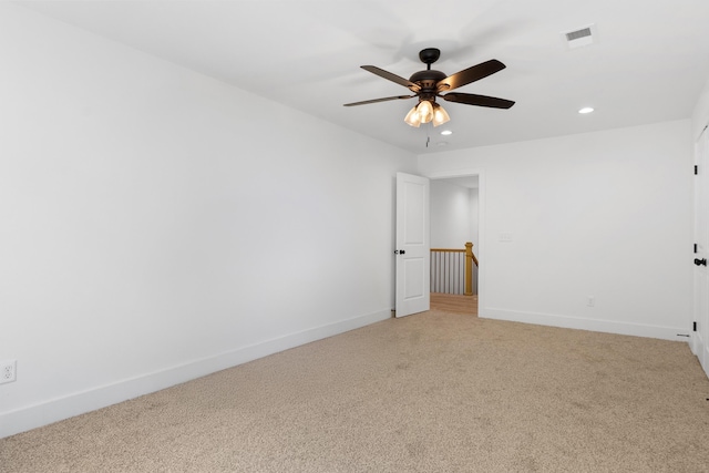 empty room with recessed lighting, visible vents, baseboards, light colored carpet, and ceiling fan