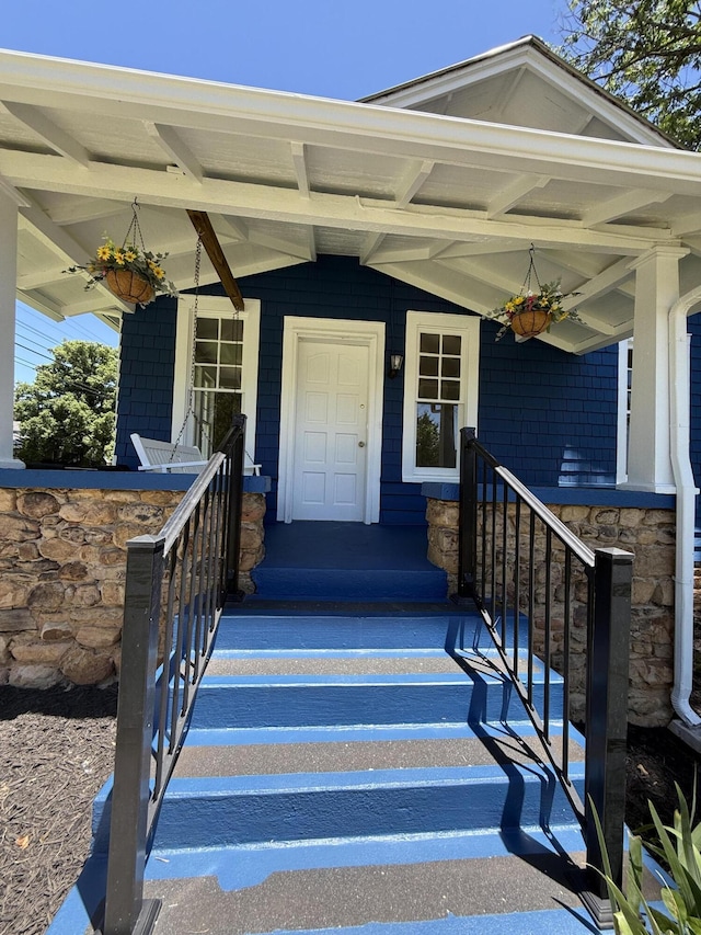 110 7th St, South Pittsburg, TN 37380 - entrance to property with covered porch and stone siding