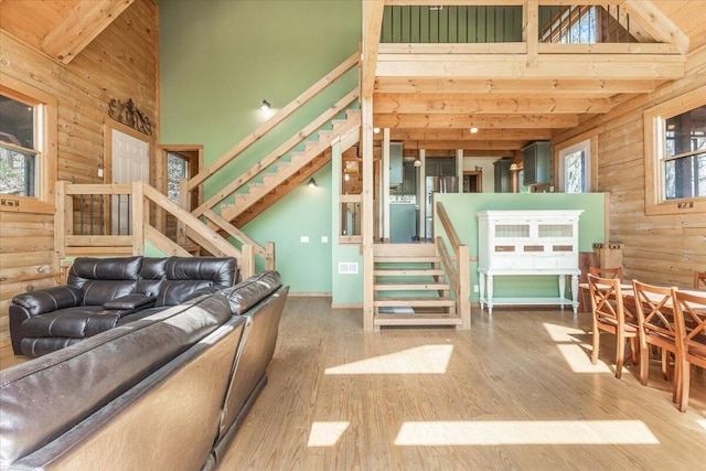 159 Eagle Creek Trl, Rising Fawn, GA 30738 - living area with wooden walls, high vaulted ceiling, and stairs
