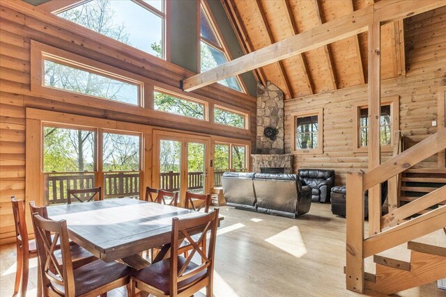 159 Eagle Creek Trl, Rising Fawn, GA 30738 - dining space featuring high vaulted ceiling, wood finished floors, a healthy amount of sunlight, french doors, and beam ceiling