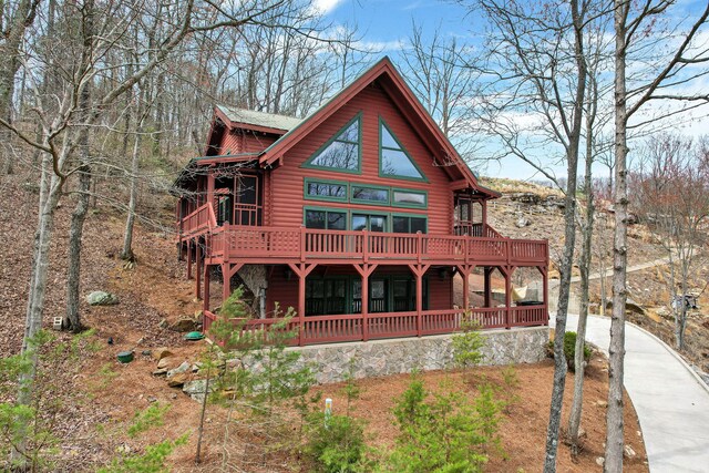 159 Eagle Creek Trl, Rising Fawn, GA 30738 - rear view of property with concrete driveway, a wooden deck, and log veneer siding