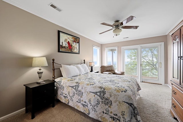 bedroom featuring light carpet, access to outside, crown molding, and visible vents