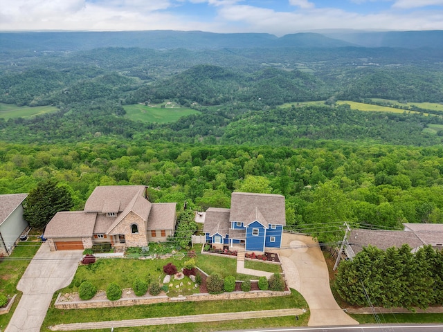 bird's eye view featuring a wooded view