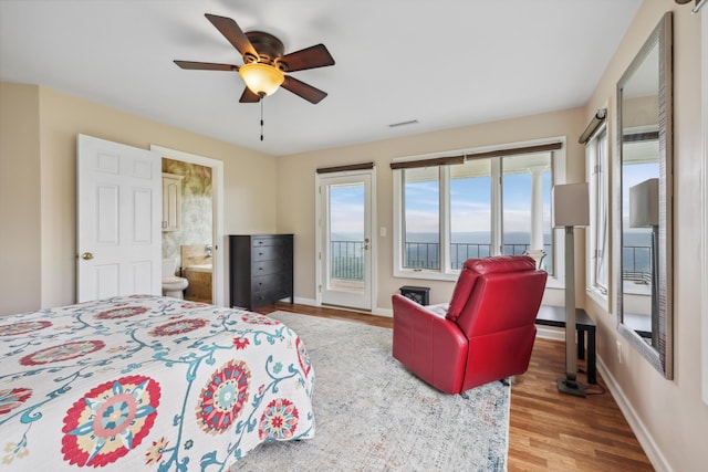 bedroom with wood finished floors, visible vents, baseboards, access to outside, and ceiling fan