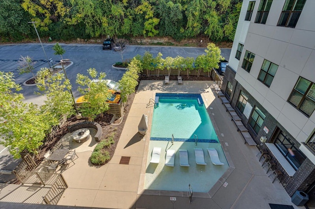 community pool with a patio area