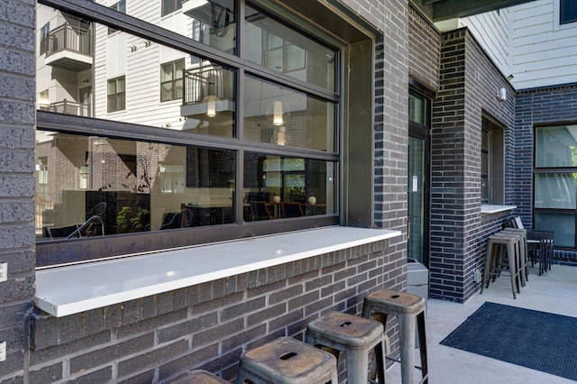 exterior space with brick siding
