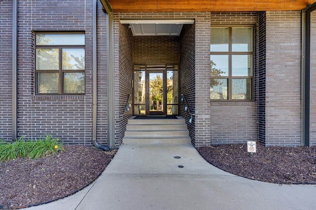 entrance to property with brick siding