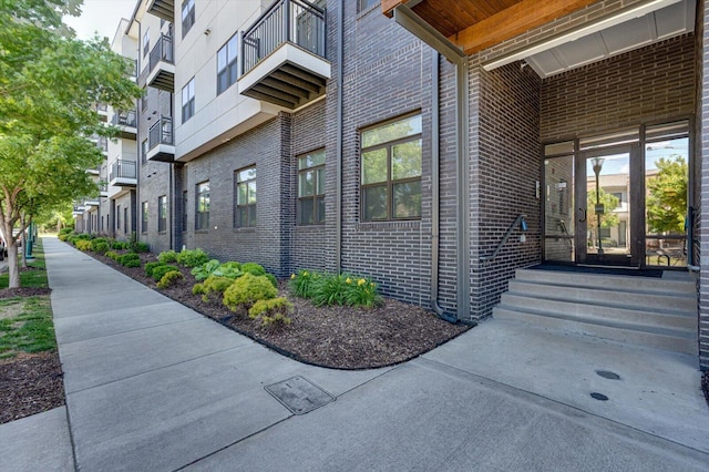 property entrance with brick siding