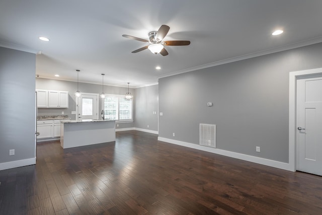 229 Courtland Crest Dr SW, Cleveland, TN 37311 - unfurnished living room featuring ceiling fan, recessed lighting, baseboards, crown molding, and dark wood-style flooring
