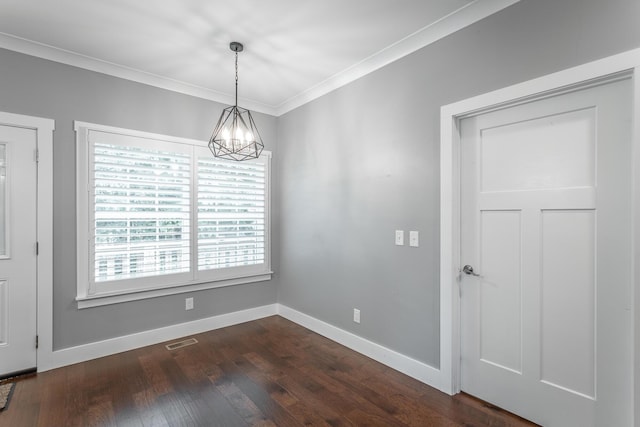229 Courtland Crest Dr SW, Cleveland, TN 37311 - unfurnished dining area featuring a chandelier, baseboards, ornamental molding, and dark wood-type flooring