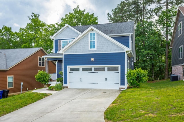 229 Courtland Crest Dr SW, Cleveland, TN 37311 - craftsman-style house with a front lawn, concrete driveway, an attached garage, and cooling unit