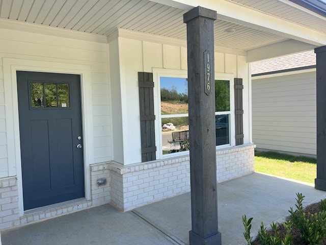doorway to property featuring a porch