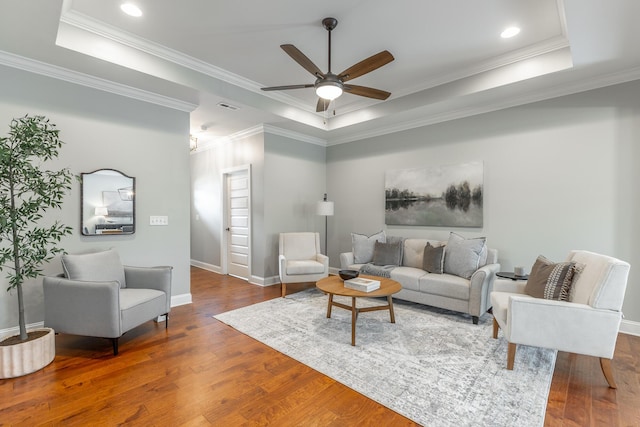 3495 Travertine Ln, Chattanooga, TN 37405 - living room featuring wood finished floors, ceiling fan, baseboards, visible vents, and a tray ceiling