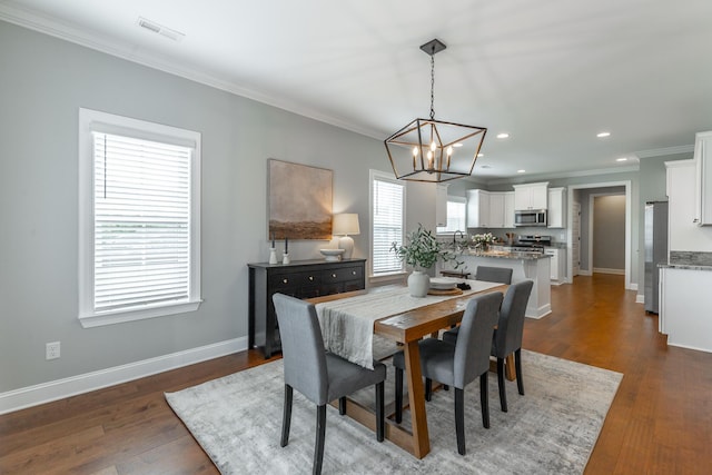 3495 Travertine Ln, Chattanooga, TN 37405 - dining area featuring crown molding, visible vents, a chandelier, dark wood-style flooring, and recessed lighting