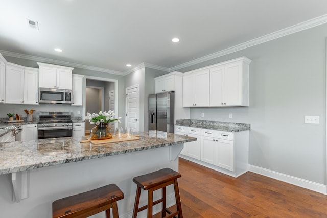 3495 Travertine Ln, Chattanooga, TN 37405 - kitchen with appliances with stainless steel finishes, light stone countertops, and white cabinets