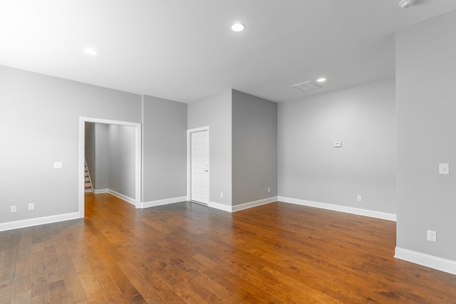 3495 Travertine Ln, Chattanooga, TN 37405 - empty room with dark wood-style floors, baseboards, and stairs
